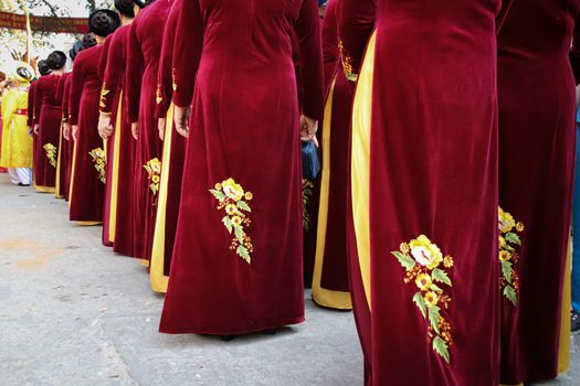 Women called Hoi dong tue wearing festival clothes during a parade for Hoi Phao Dong Ky or Dong Ky Firecracker Festival in Bac Ninh, Vietnam