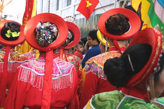 Women called Hoi dong tue wearing festival clothes during a parade for Hoi Phao Dong Ky or Dong Ky Firecracker Festival in Bac Ninh, Vietnam