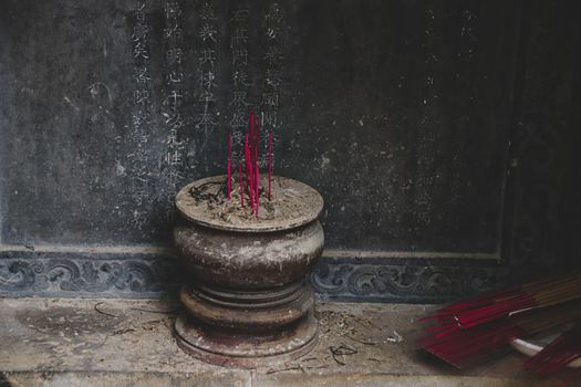 Editorial use only. Red incense for Tet Holiday in the ancient Hon Chen Temple in Hue, Vietnam. January 6, 2020