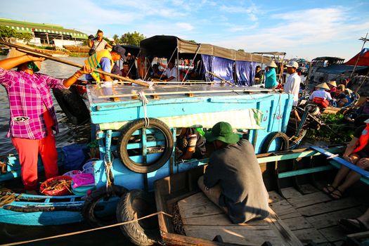 Everyday life in Cai Rang Floating Market in Can tho, Vietnam which is a popular tourist destination and considered to be the largest traditional floating market in Asia