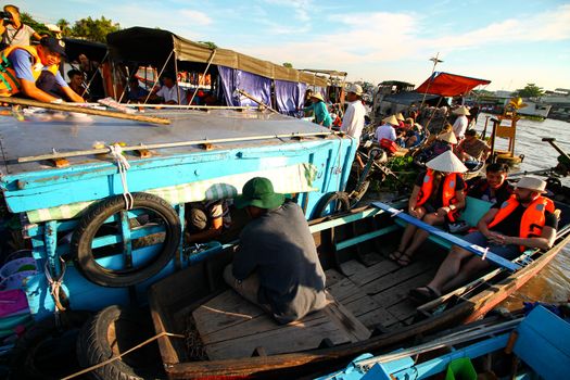 Editorial Everyday life in Cai Rang Floating Market in Can tho, Vietnam which is a popular tourist destination and considered to be the largest traditional floating market in Asia