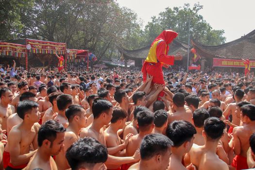 Editorial. Crowd of Vietnamese people celebrating the annual Dong Ky Firecracker Festival in Bac Ninh, Vietnam