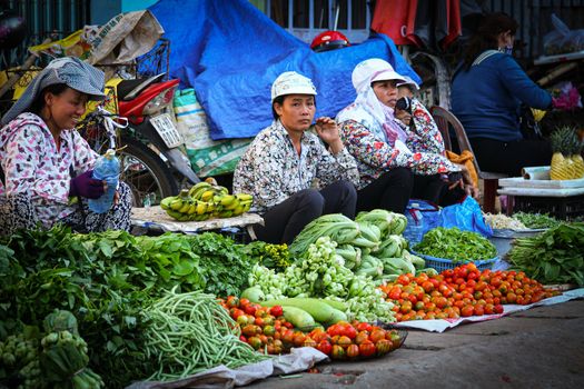 Editorial. Market vendors in selling local fresh produce in Hoi an, Vietnam