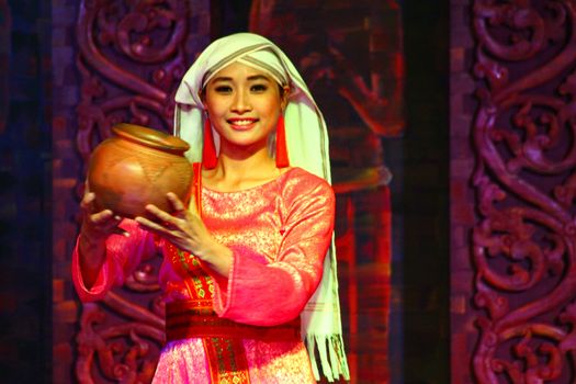 Editorial. A dancer performs a traditional Vietnamese folk dance in My Son Sanctuary in Hoi an, Vietnam