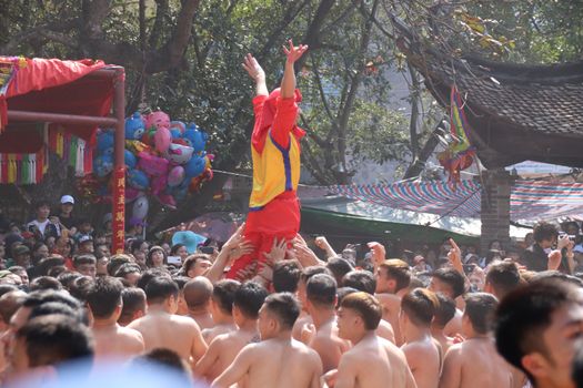 “Ong dam” procession at the communal house during the Dong Ky Firecracker Festival or Hoi Phao Dong Ky in Bac Ninh Vietnam