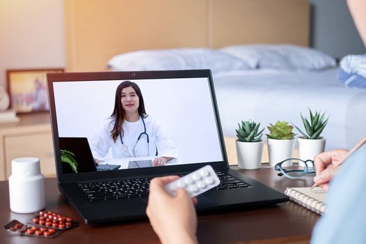 sick woman use video conference, make online consultation with doctor via laptop computer, patient ask doctor about illness and medication via video call. Telehealth, Telemedicine and online hospital