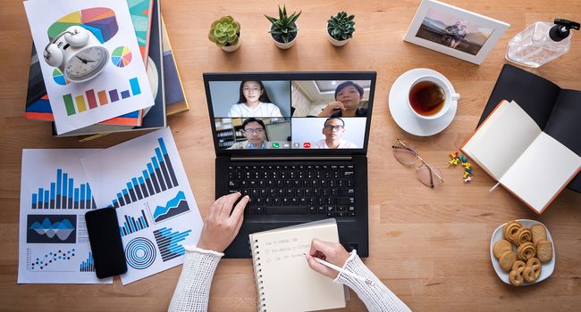 work from home. people making video conference with colleague via laptop computer during home quarantine to avoid spreading illness transmission of COVID-19 Coronavirus outbreak. self isolation