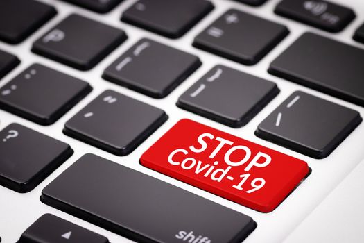 Stop covid-19 concept. red keyboard with text stop covid-19, awareness campaign on social media for prevention of coronavirus during the covid-19 epidemic outbreak.