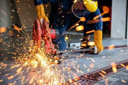 Craftsman Welding is Cutting Steel Work, Welder Man in Safety Protective Equipment Doing Metalwork in Construction Site. Engineering Labor Skill and Workshop Production Concept