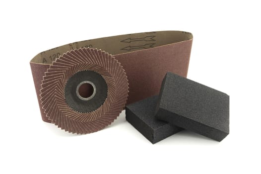 Set of different tools for grinding - sanding belt, abrasive sponge and flap disc for angle grinder, isolated on white background