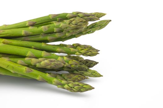 Bunch of fresh green asparagus isolated on white background