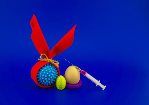 Corona virus models wrapped as gifts and Easter eggs on a blue background with copy space