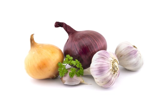 Garlic bulbs and cloves, green parsley twig, golden-brown and red onion isolated on white background