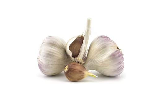 Garlic bulbs and cloves in close-up isolated on white background