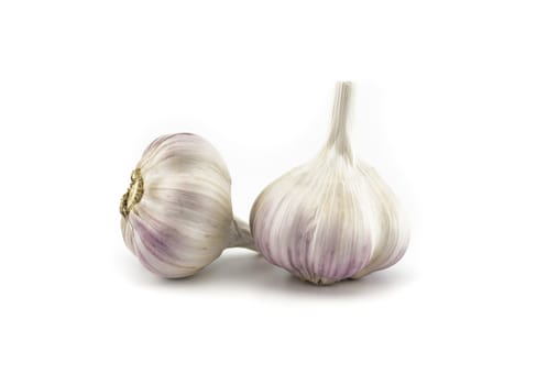 Garlic bulbs in close-up isolated on white background