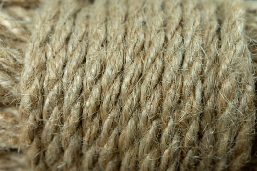Jute twine in close-up on grey rustic background