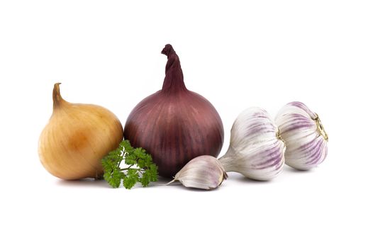 Garlic bulbs and cloves, green parsley twig, golden-brown and red onion isolated on white background