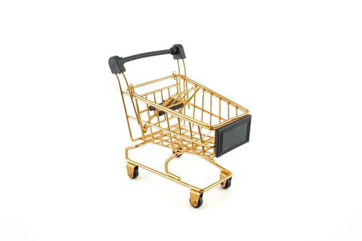 Empty golden shopping cart isolated on white background