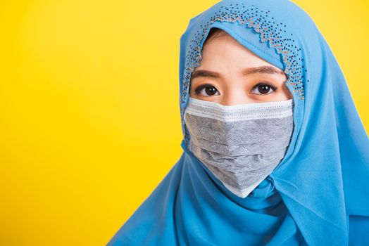 Asian Muslim Arab, Portrait of happy beautiful young woman religious wear veil hijab smiling studio shot isolated, yellow background with copy space, Close up skin face