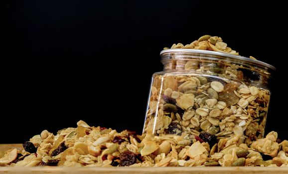 Granola in the Glass on black Background