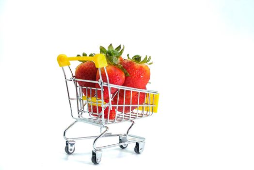 Close up strawberry on shopping cart isolatd on White Background