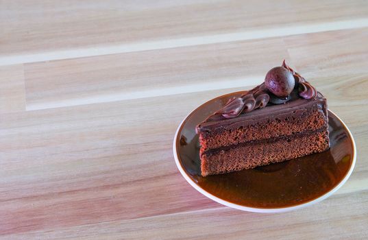 chocolate cake on wooden table