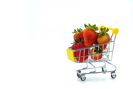 Close up strawberry on shopping cart isolatd on White Background