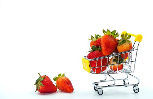 Close up strawberry on shopping cart isolatd on White Background