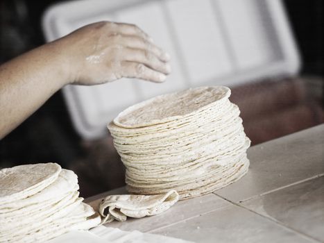 Close Up Of A Hand And Tortillas