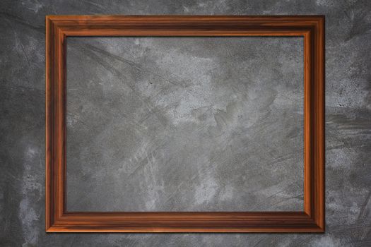 Creative wooden frame on concrete texture background, vintage and retro concept