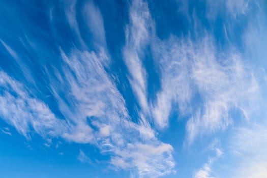 Stunning cirrus cloud formation panorama in a deep blue summer sky seen over Europe