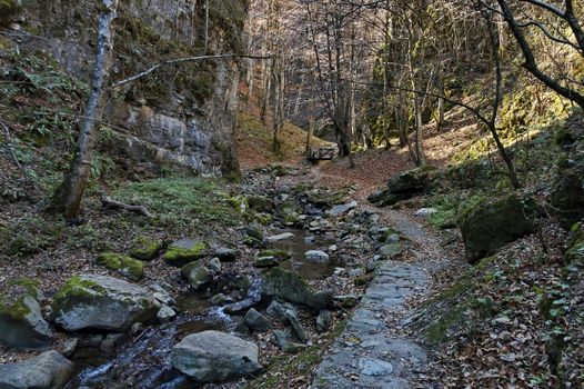 Autumn walk through the labyrinth of the Teteven Balkan with high peaks, river and bridge, Stara Planina, Bulgaria