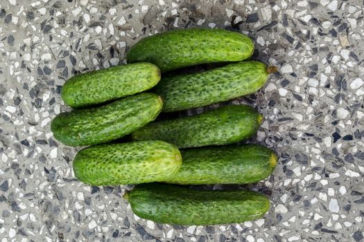 A stack of several fresh green cucumber gherkins on the mosaic, Sofia, Bulgaria