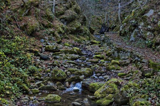 Autumn walk through the labyrinth of the Teteven Balkan with high peaks, river and bridge, Stara Planina, Bulgaria