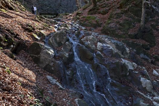 Autumn walk through the labyrinth of the Teteven Balkan with high peaks, river and bridge, Stara Planina, Bulgaria