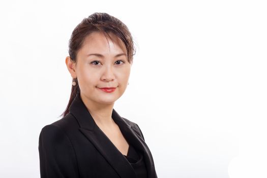 Asian American businesswoman looking at camera on white background