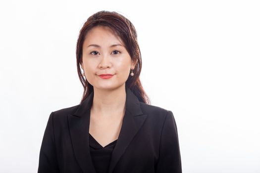 Asian American businesswoman looking at camera on white background