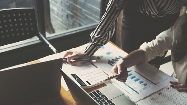 Business team analyzing income charts and graphs with modern laptop computer. Close up.Business analysis and strategy concept.
