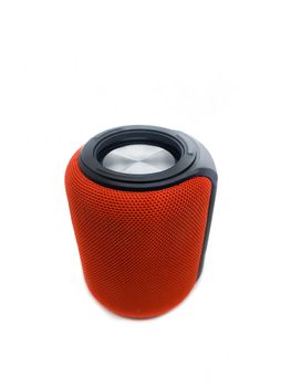 Mini red bluetooth speaker isolated on over white background.