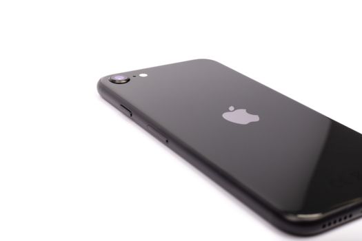 Paris, France - May 14, 2020: Design of the new black iPhone SE 2020 from the multinational company Apple during the days of its studio release on a white background