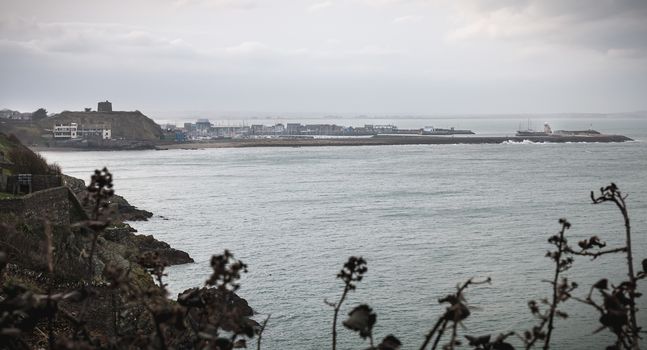 Distant view of a small touristy fishing port near Dublin on a winter day