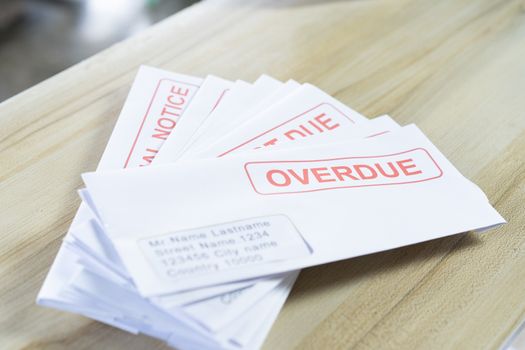 Outstanding invoices are placed on the table.