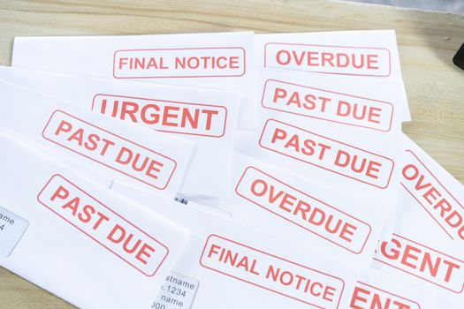 Outstanding invoices are placed on the table.