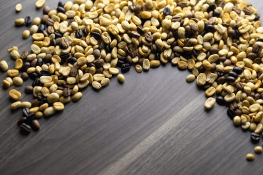 Coffee beans. Coffee beans that have not been baked on the wood floor.