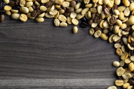 Coffee beans. Coffee beans that have not been baked on the wood floor.