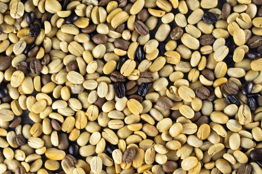 Dry coffee beans onthe wood background