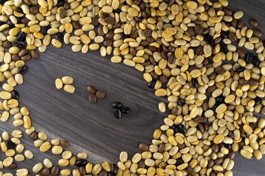Striped coffee beans isolated in a wooden background