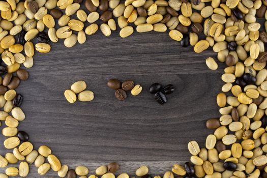 Striped coffee beans isolated in a wooden background
