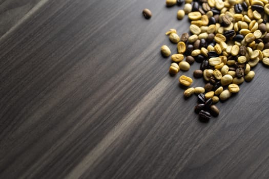 Coffee beans. Coffee beans that have not been baked on the wood floor.