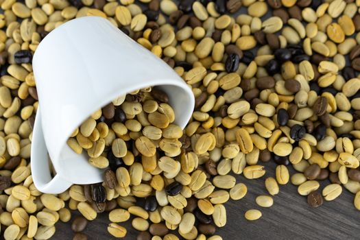 Close-up of the white coffee and raw coffee beans in the upper right corner.